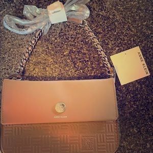 Never carried, tags still on. Blush pink